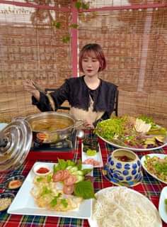 May be an image of 1 person, standing, hot pot and indoor