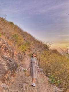 May be an image of 1 person, standing and nature