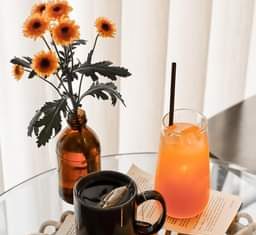 May be an image of drink, flower and indoor